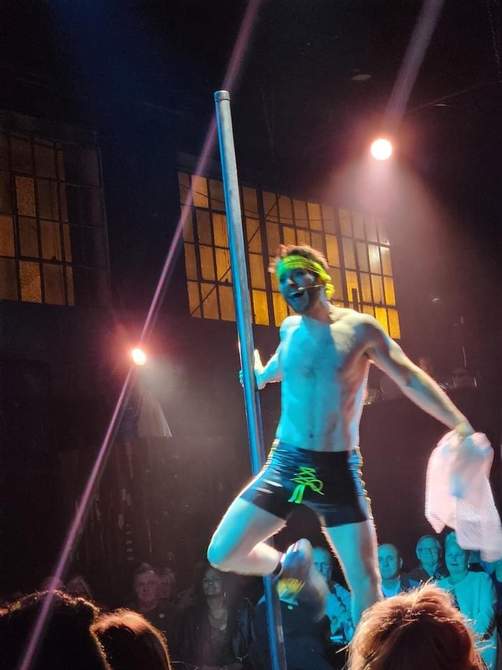 Saucy Jack and the Space Vixens 2022 — pole dancer performing on stage